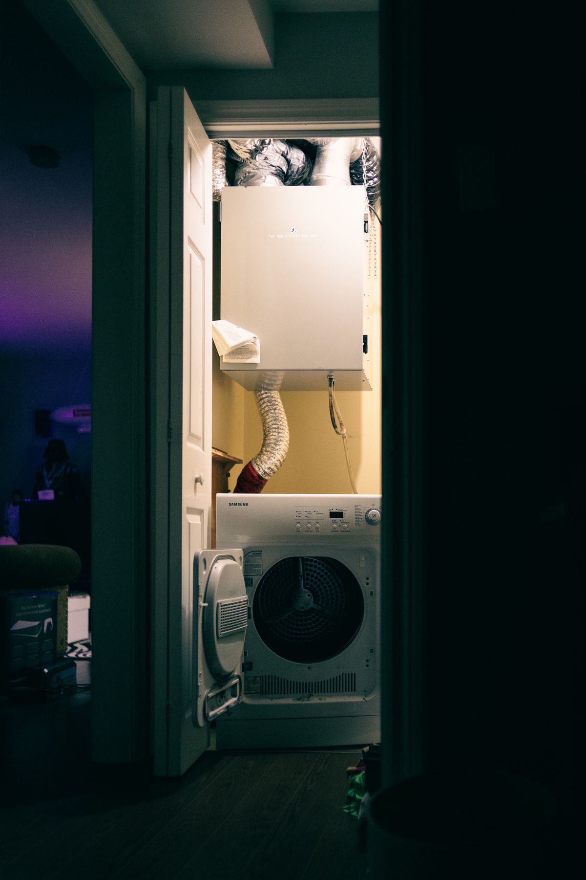 Laundry closet with a dryer and ventilation ducting