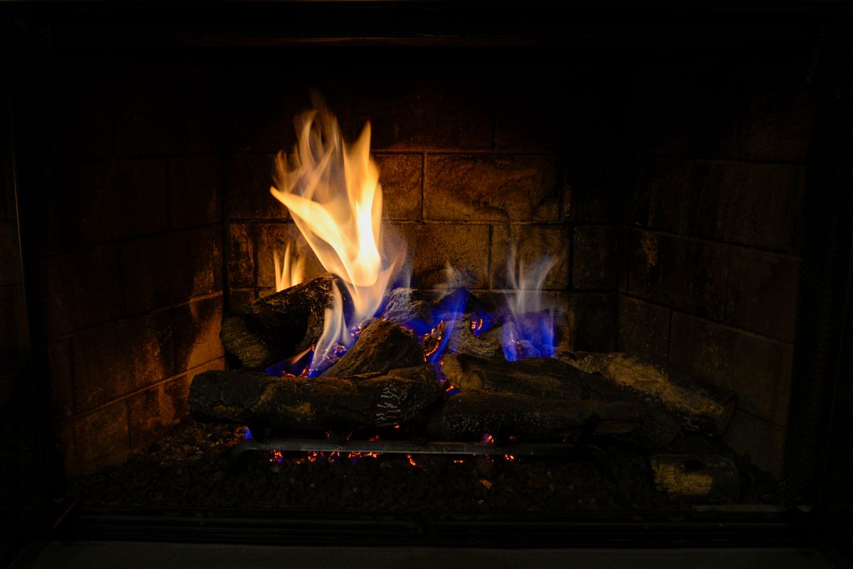 Warm fire burning in an indoor fireplace