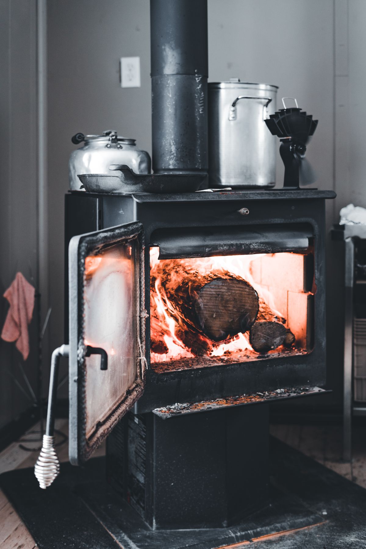 Wood-burning stove warming a room